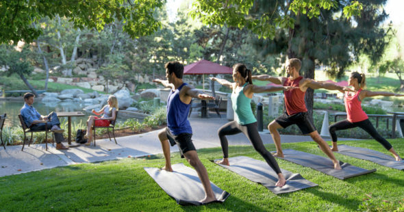 A group of men and women doing yoga at The Plaza, 4350 La Jolla Village Drive in San Diego, CA