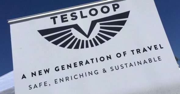 Photo of the Tesloop logo and mission statement, "A New Generation of Travel - Safe, Enriching & Sustainable"