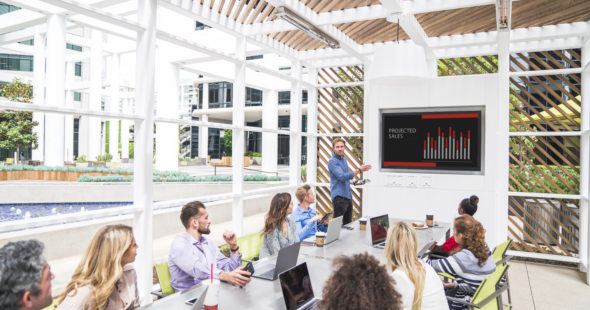 Photography of people enjoying The Commons, an outdoor workplace and gathering area, at Irvine Towers in Irvine, CA