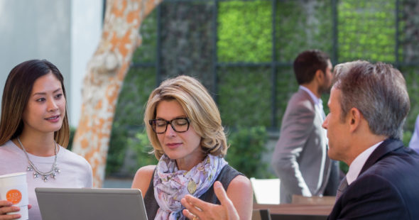 Photography of businesspeople working at The Commons, an outdoor workspace and gathering area located at 610 Newport Center in Newport Beach, CA