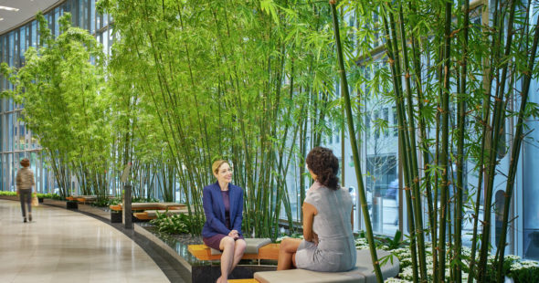 Photography of the interior walkway and 2 women having a conversation at the seating areas at 71 South Wacker in Chicago, IL