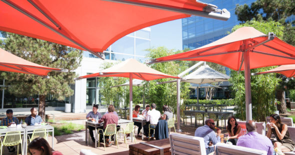 Photography of people enjoying The Commons, an outdoor workplace and gathering area, at Santa Clara Square in Santa Clara, CA